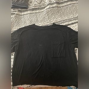 large black short sleeved shirt with pocket
